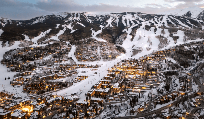Snowmass at night, the towns lights twinkle in the dusk